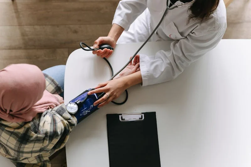 Doctor taking blood pressure
