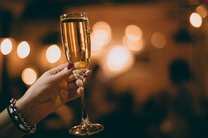 hand holding champagne glass