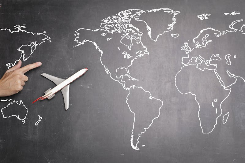 Airplane on blackboard map