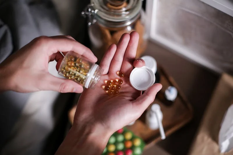 Woman pouring out medication