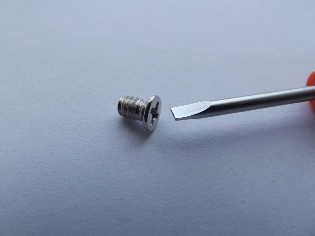 flathead screwdriver with Phillips screw