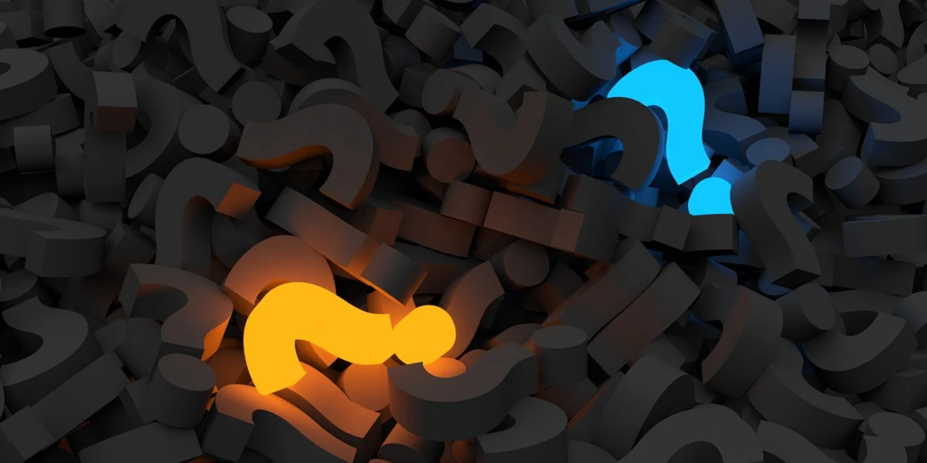 glowing question marks in a pile