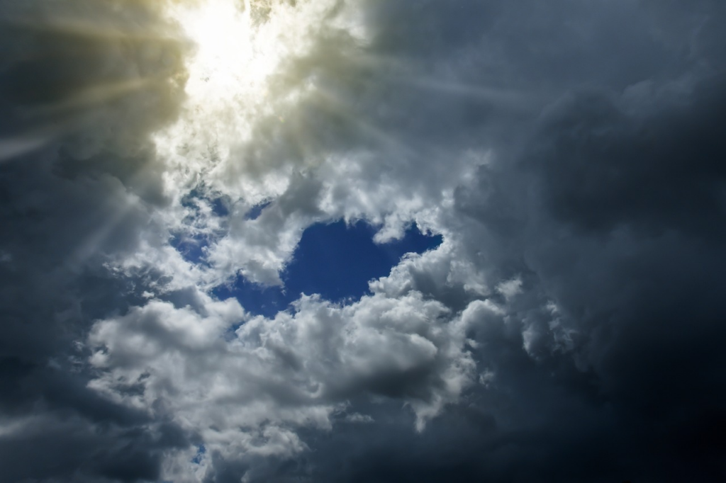 sun peaking through the clouds