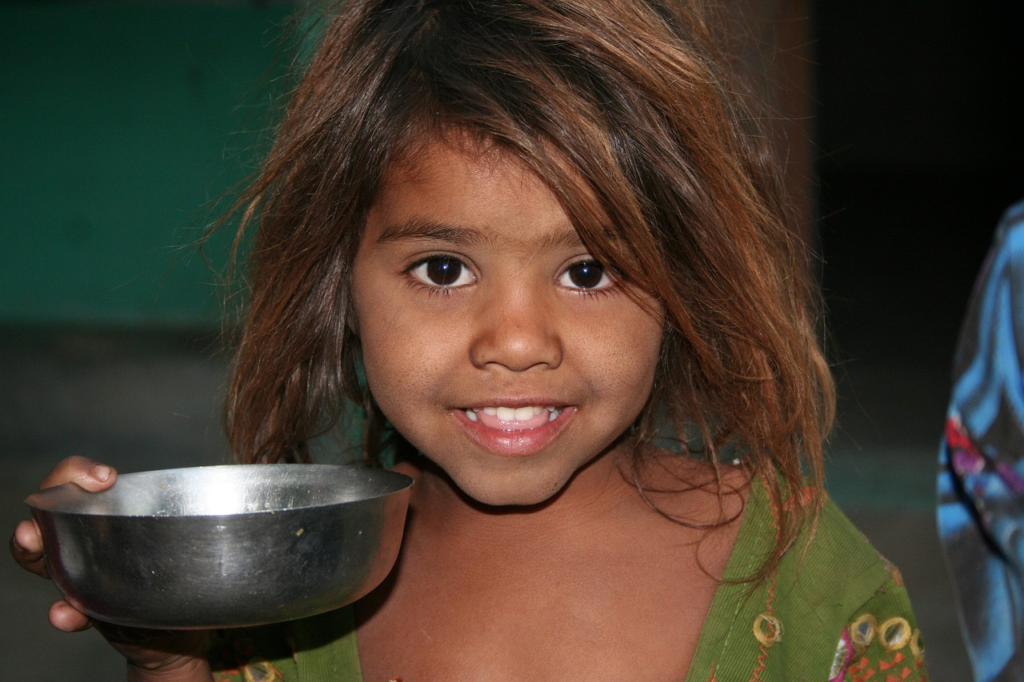 smiling child with bowl