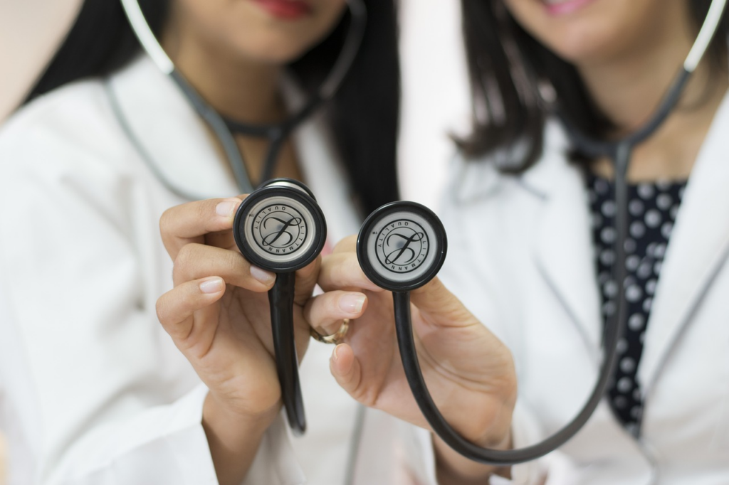 two doctors with stethosopes