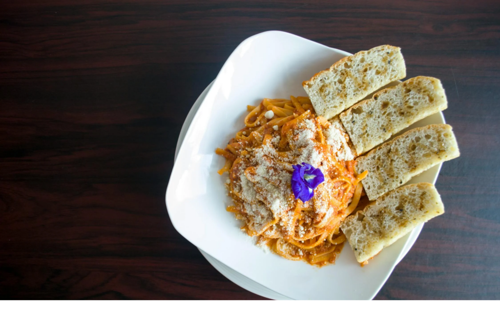 Bowl of Pasta with Garlic Bread