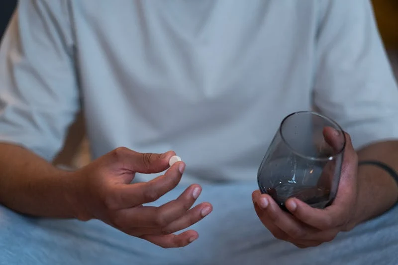 person taking aspirin