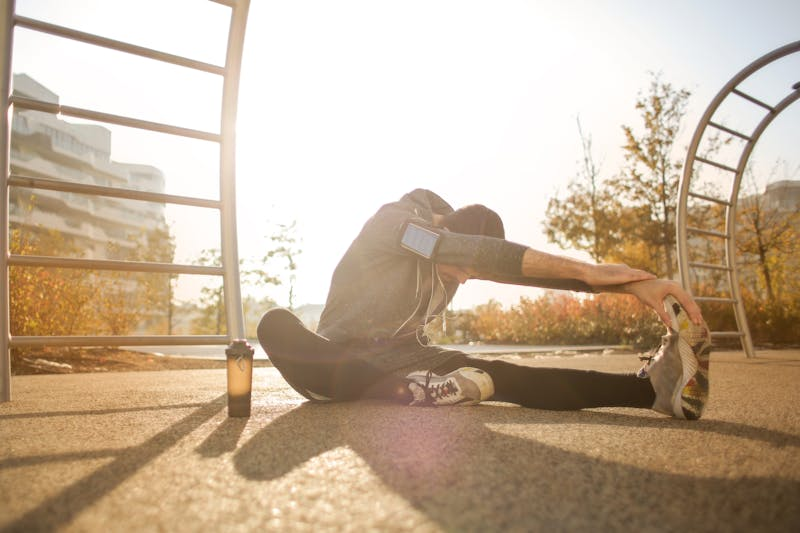 woman stretching on the ground