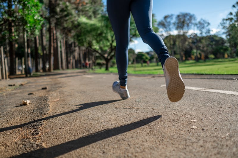 person jogging on a trail