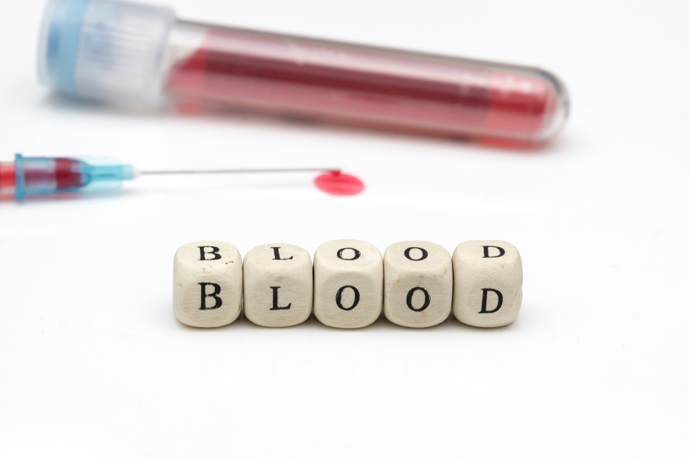 the 'BLOOD' concept of blood samples in the test tube, the droplets of the injection tip end