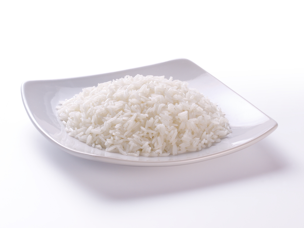 cooked rice on plate and white background