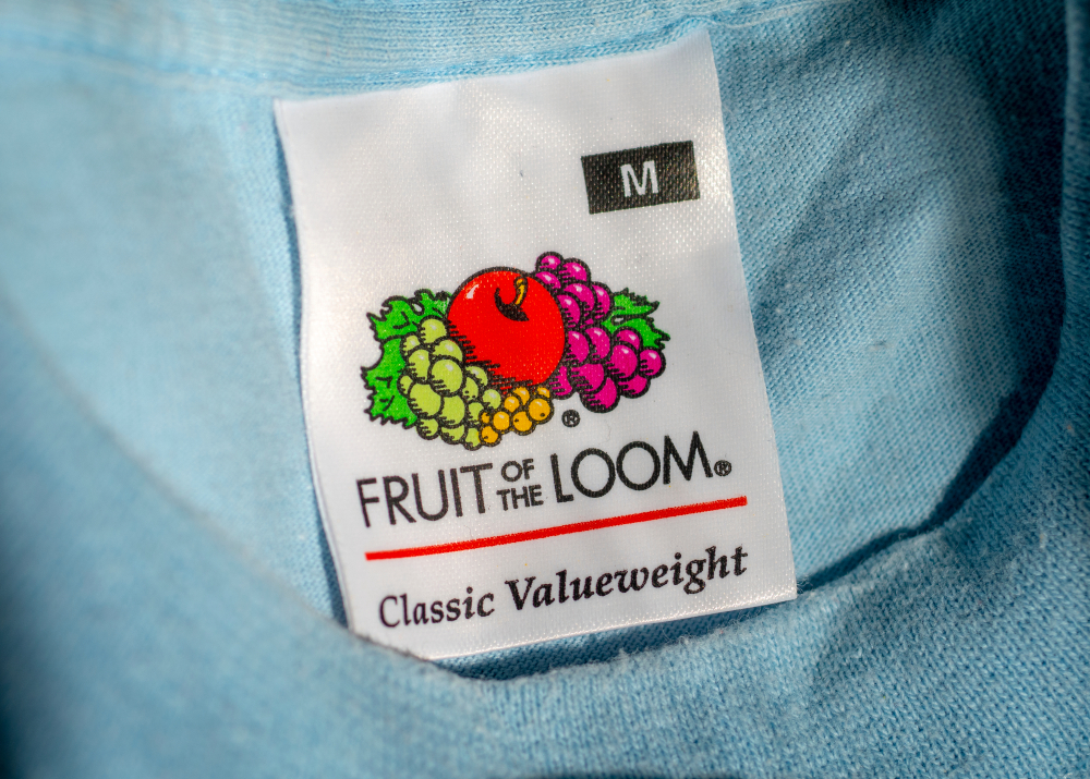 London, England - March 25, 2019: Fruit of the Loom Logo inside an item of clothing, Fruit of the Loom is an American clothing manufacturer founded in 1851.