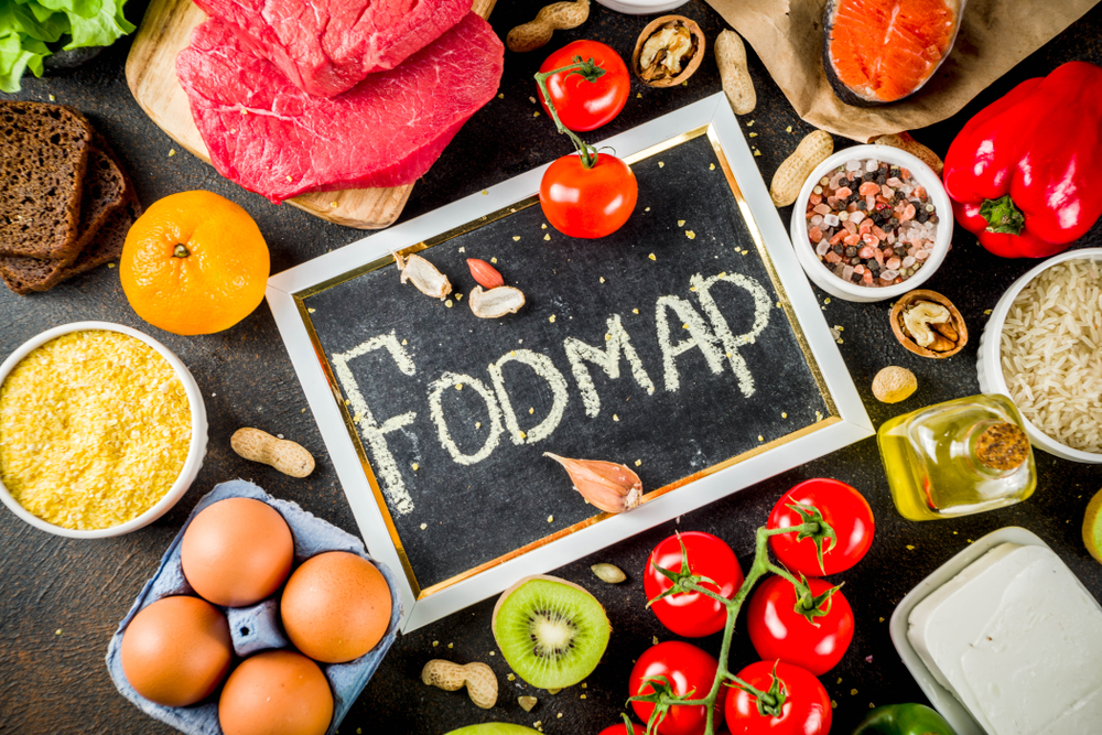 Healthy diet food. Various low fodmap ingredients selection - meat, vegetables, berry, fruit, grains, Trendy healthy lifestyle concept. On dark rusty background copy space top view
