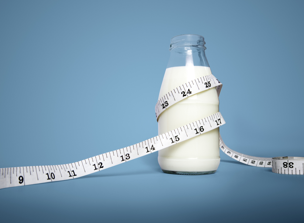 Milk bottle with Waist tape measure