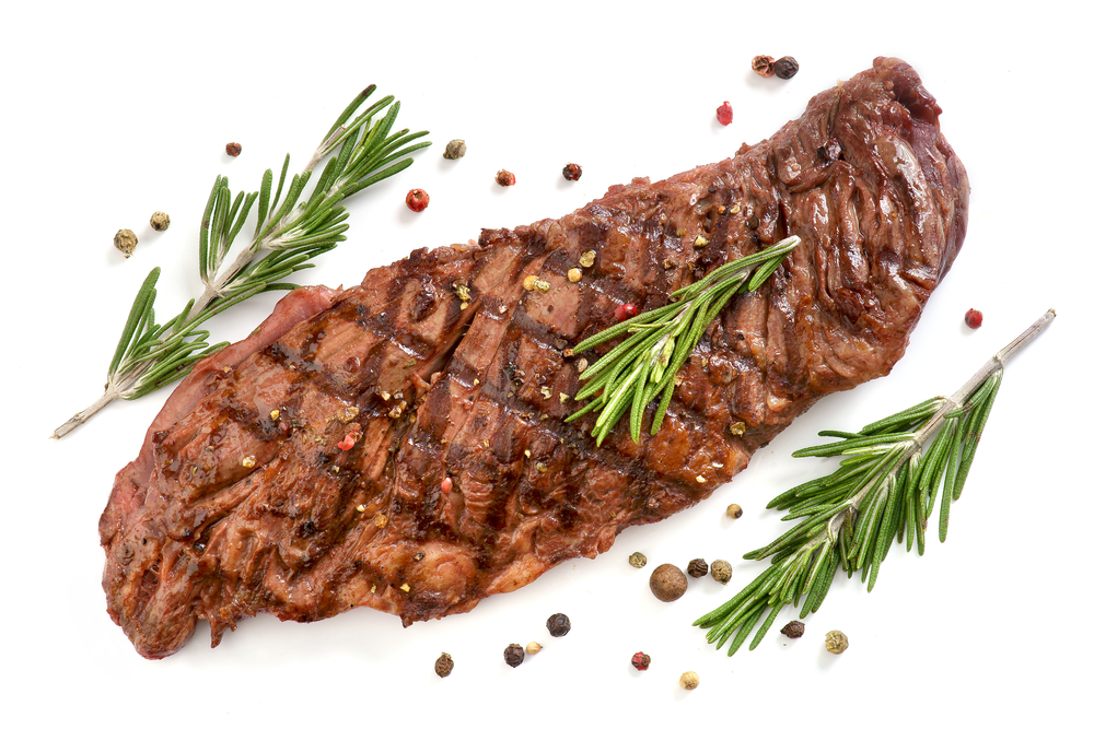fried skirt steak on a white background