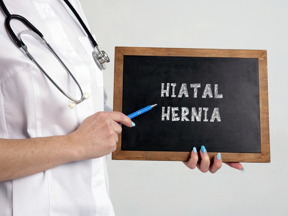 Conceptual photo about HIATAL HERNIA with written text.