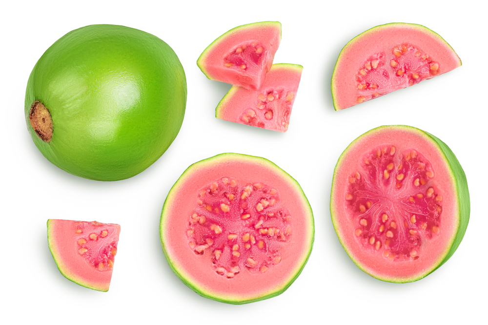 Guava fruit with slices isolated on white background with clipping path and full depth of field. Top view. Flat lay