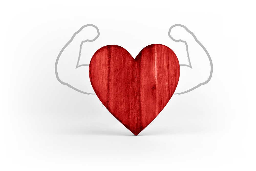 Red heart strong with muscles symbol of health and well being
