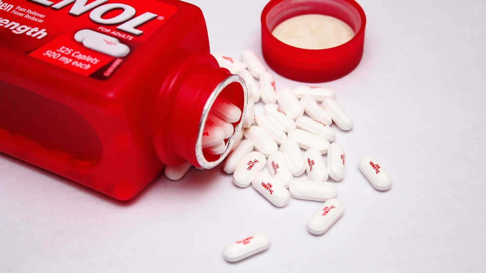 WASHINGTON, USA - July 21, 2022 : Bottle Of Tylenol Extra Strength With Many Pills On A Wooden Table Which Was Sold Out During Covid-19 time, headache, Painkillers