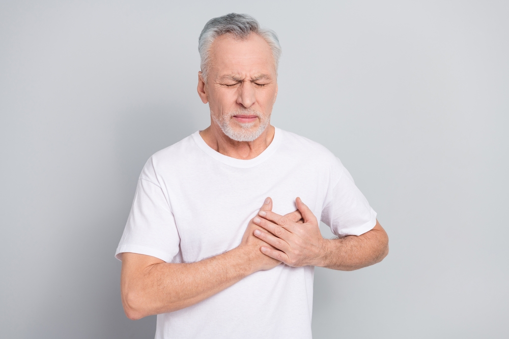 Photo of aged man touch breast suffer angina attack need medical care isolated silver color background
