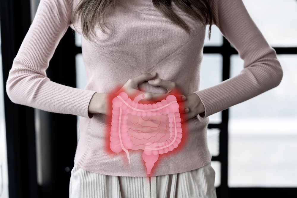 woman hands touching on stomach with intestine virtual icon, probiotics food for gut health, colon cancer, bowel inflammatory. Healthy feminine concept.