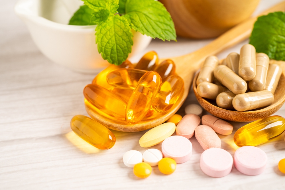 Alternative medicine herbal organic capsule with vitamin E omega 3 fish oil, mineral, drug with herbs leaf natural supplements for healthy good life.