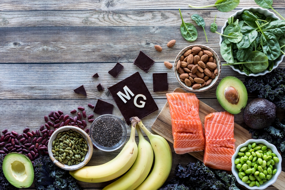 An assortment of food high in magnesium with the element symbol MG.