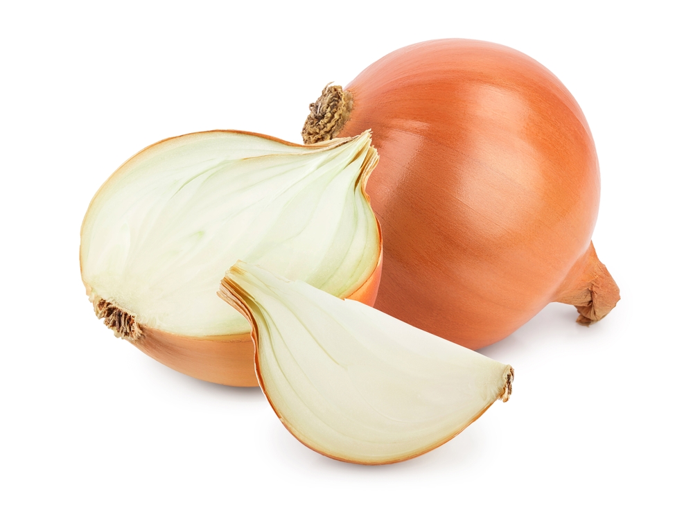 yellow onion half isolated on white background close up
