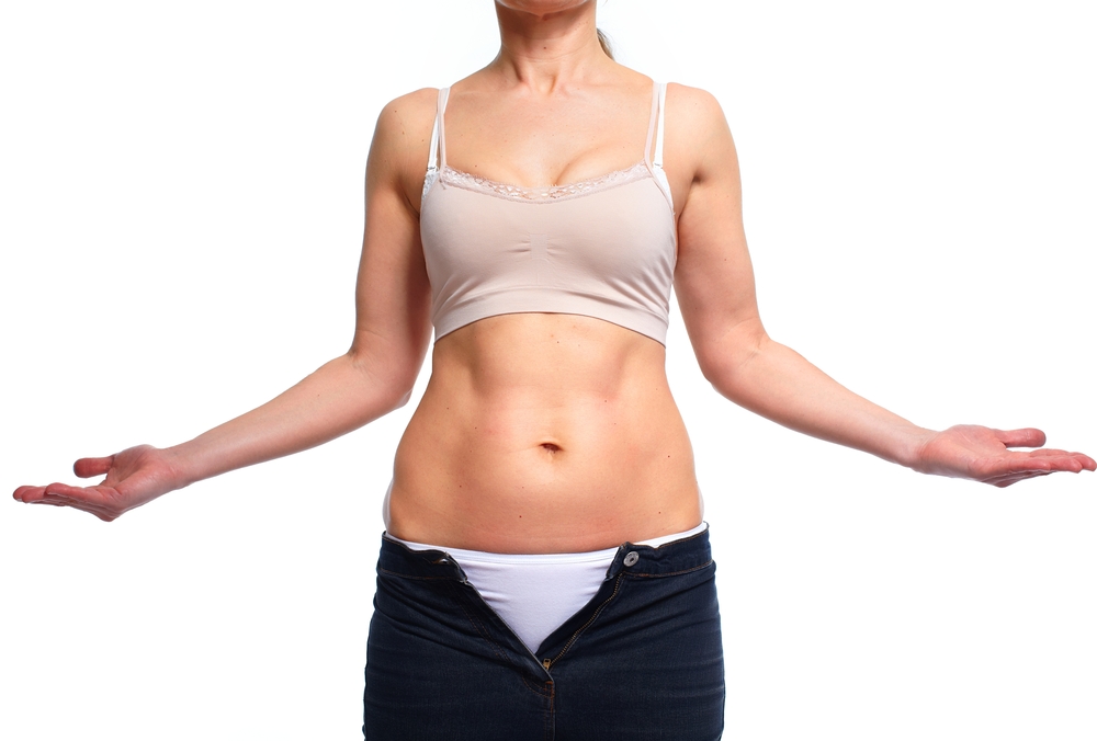 Woman fat belly. Diet and weight loss concept.