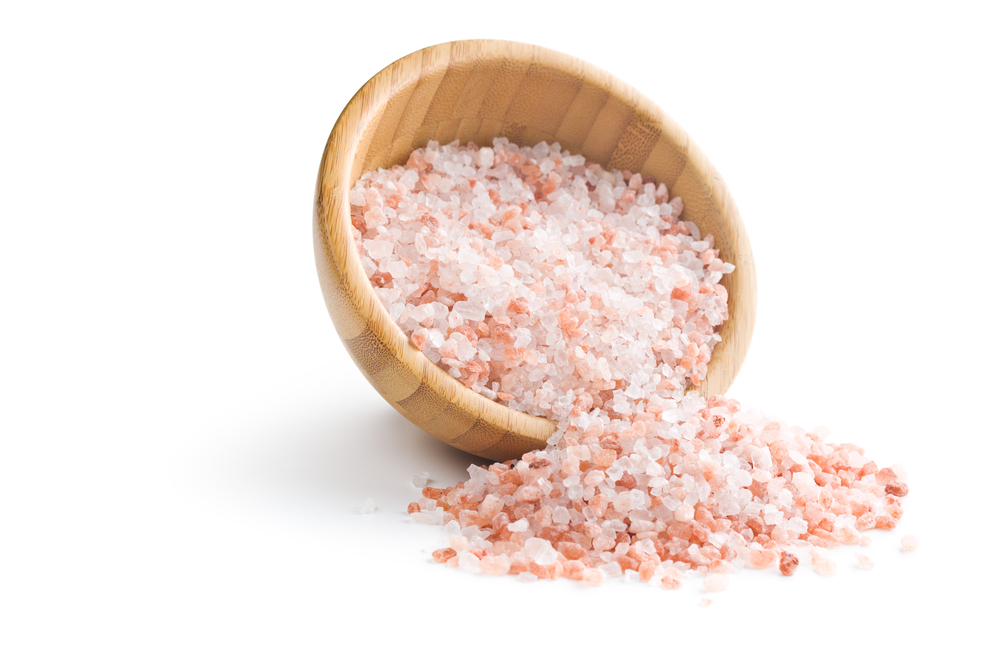Himalayan salt in bowl on white background