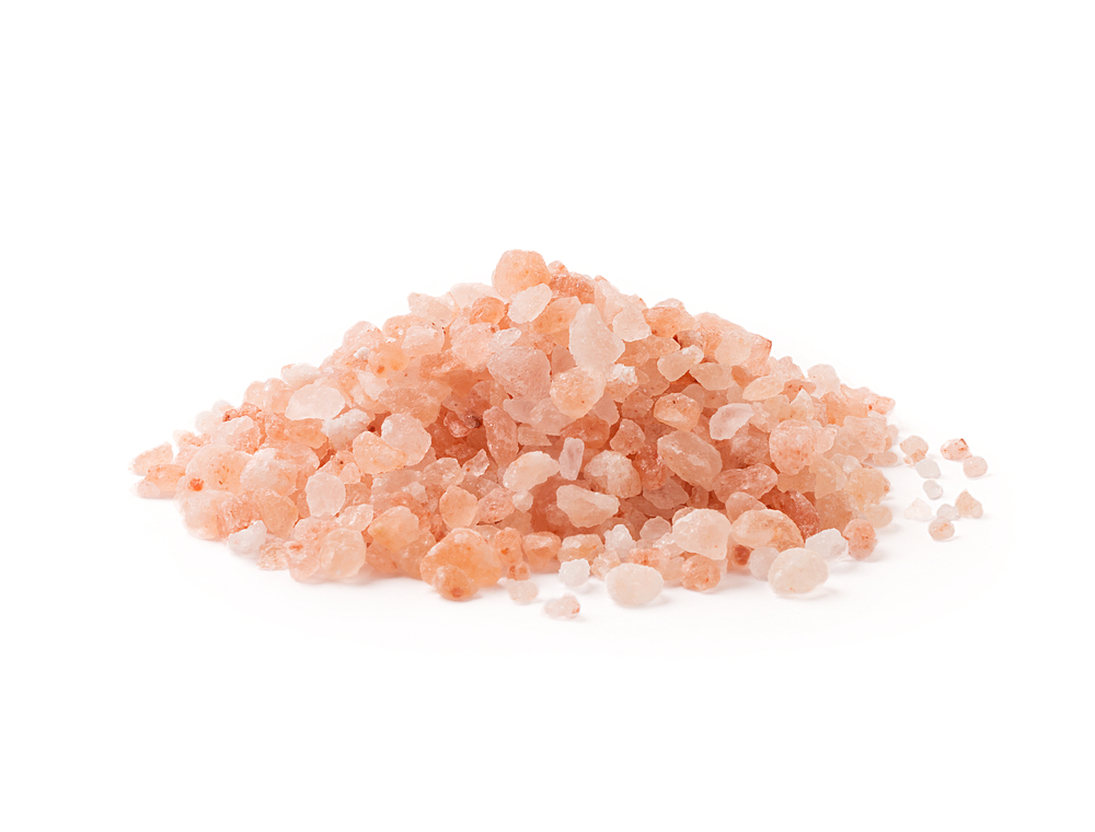 Himalayan salt pile on white background.
