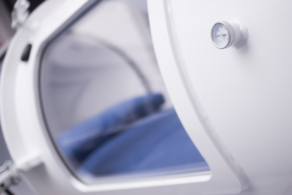 HBOT hyperbaric oxygen therapy tank chamber in hospital clinic to treat patients for diseases and medical conditions.
