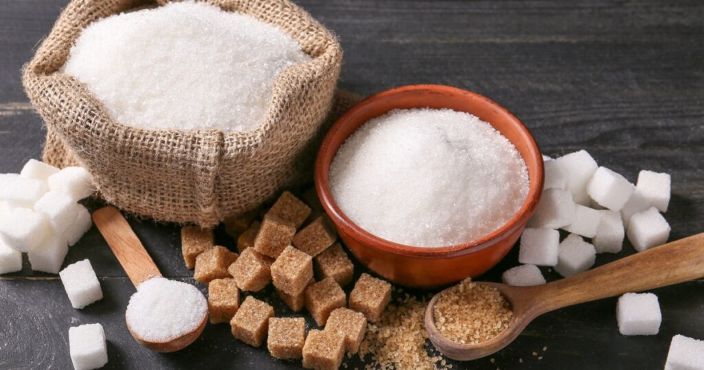Different sugar on dark table