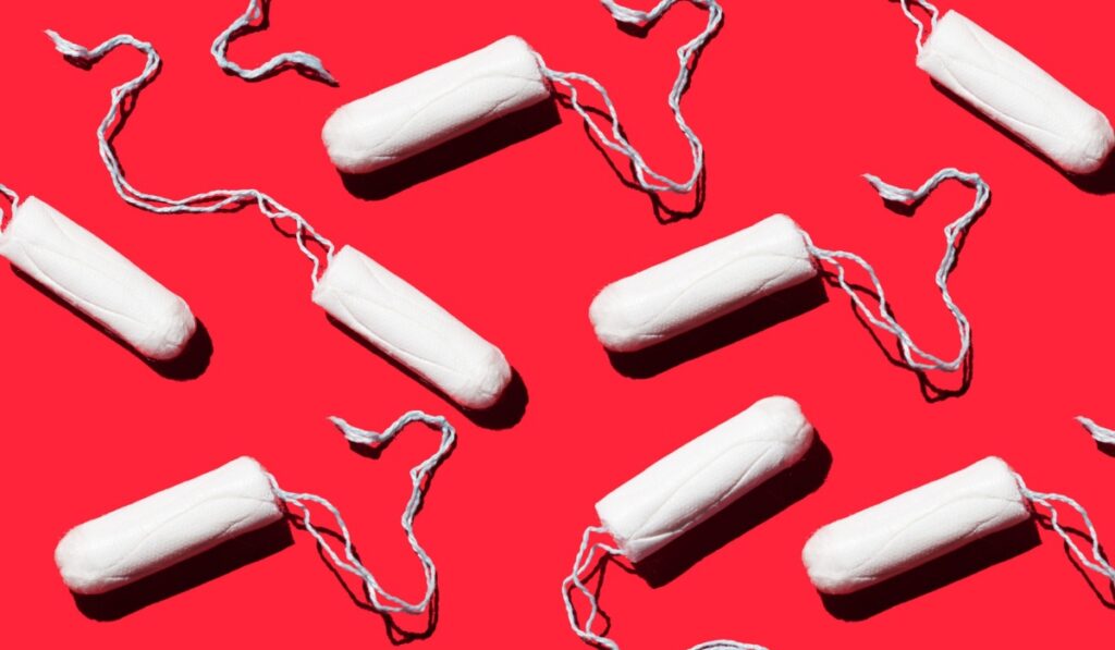 feminine hygiene tampons on a red
