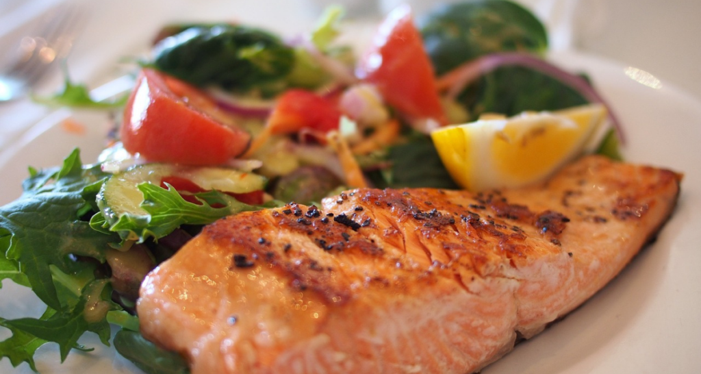 Plated salmon and a salad. 