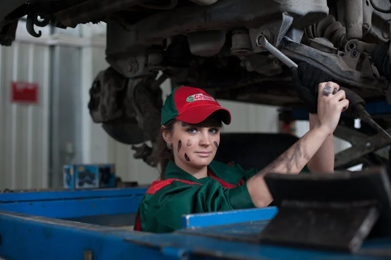 woman changing a car's oil