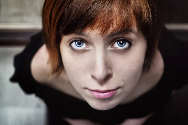 woman looking up with blue eyes