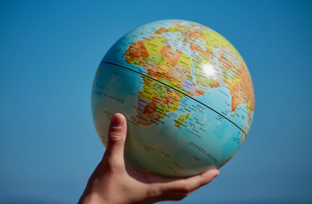 hand holding a globe
