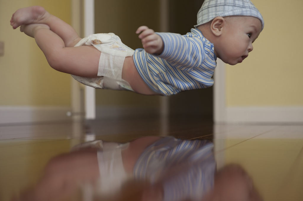 baby floating above the ground