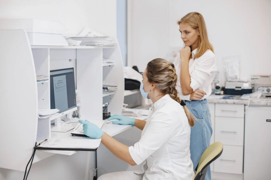 Medical Workers Looking a Computer Screen
