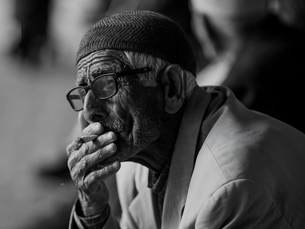 Elderly Man Smoking Cigarette