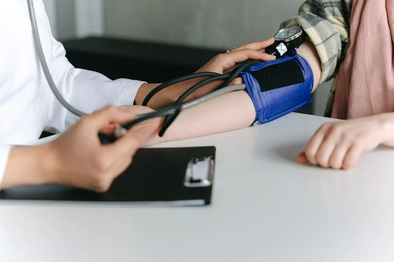person getting their blood pressure checked