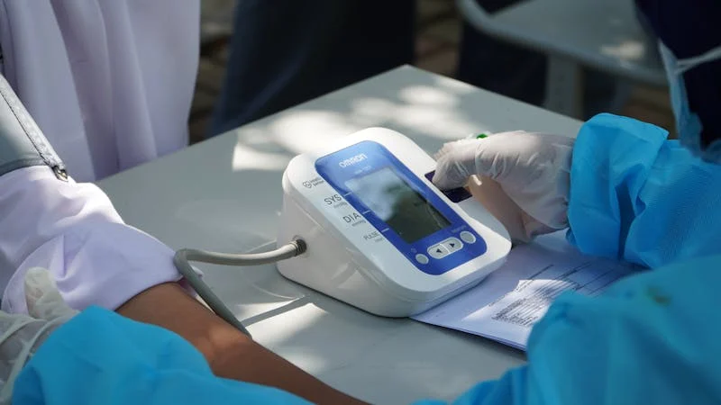 doctor checking blood pressure