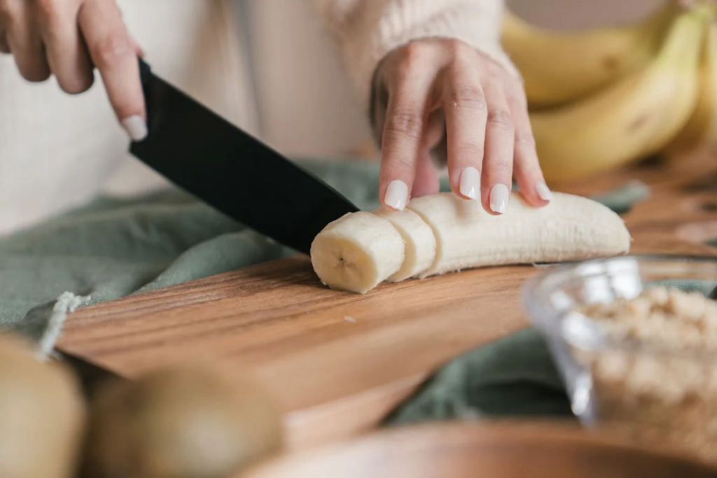 woman chopping banana