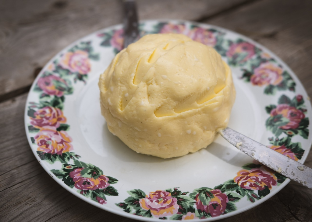rounded butter on a fancy plate