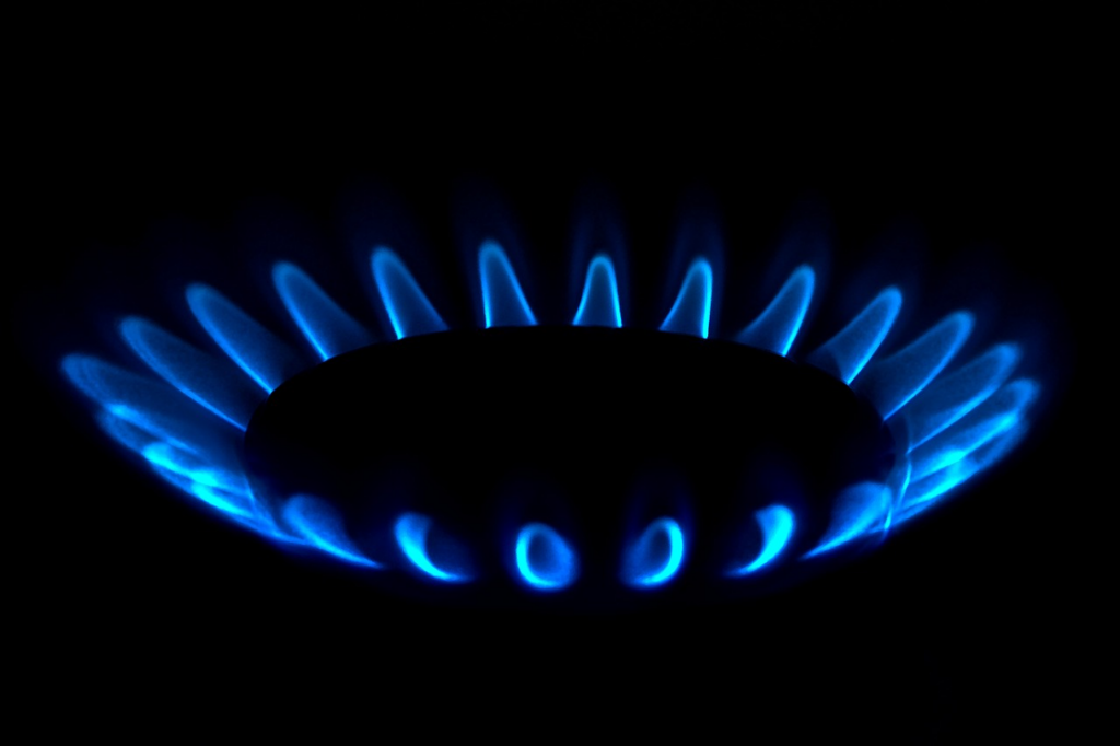 close-up low flame of a gas stove burner
