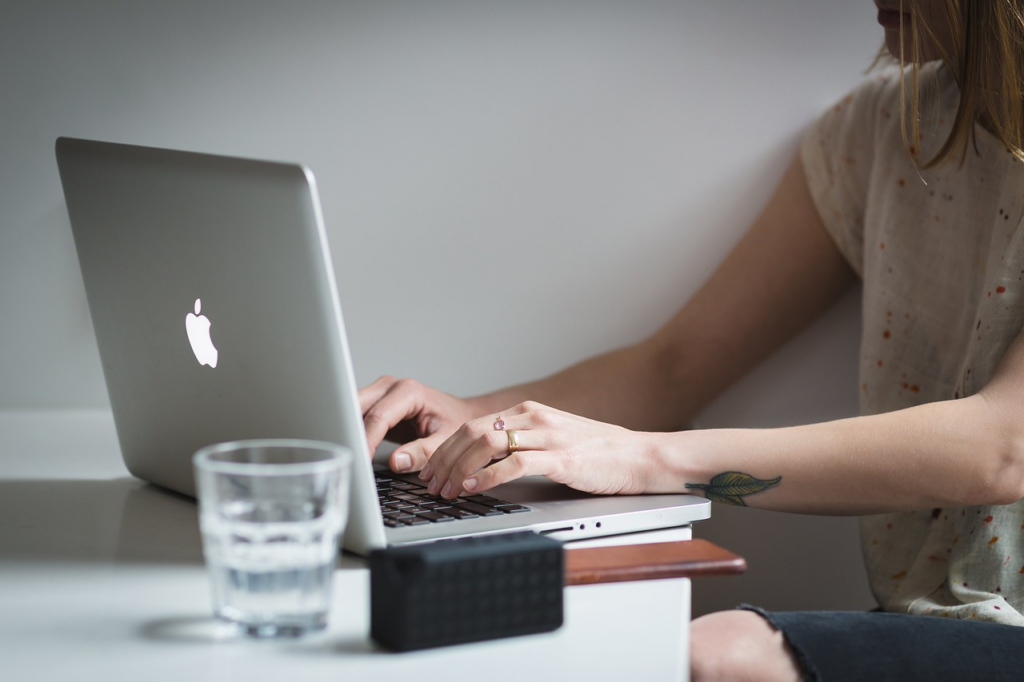 person doing research on a laptop
