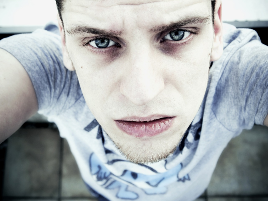 top-angle view of a pale man