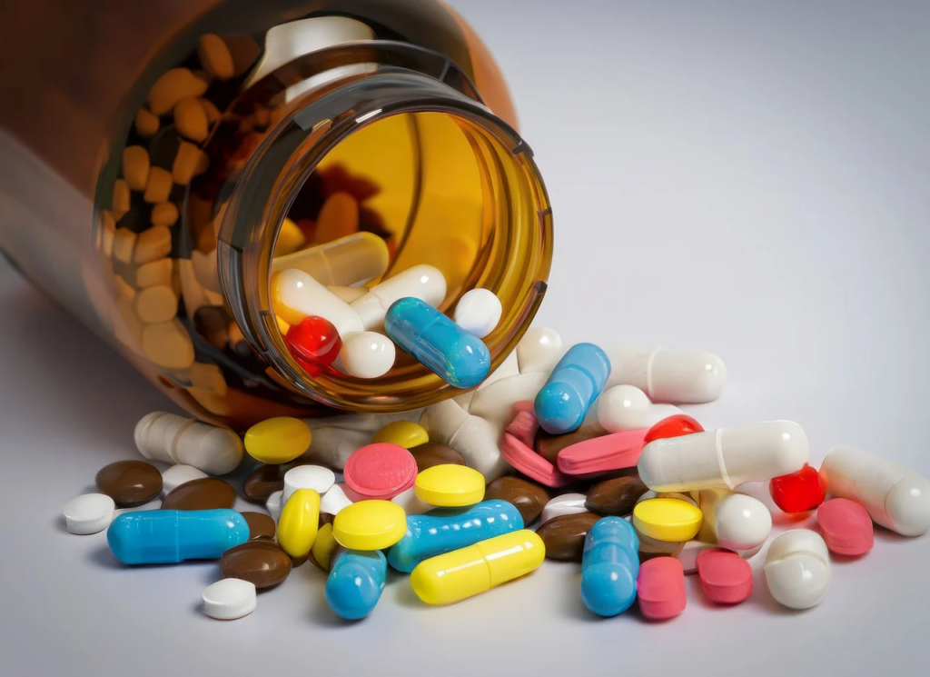 a container of pills being spilled out