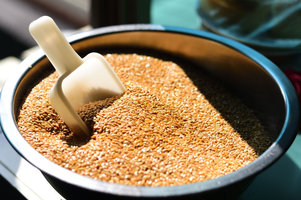 bowl of flaxseed with a scoop in it